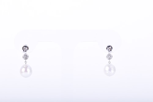 Lot 84 - A pair of diamond and pearl drop earrings each...