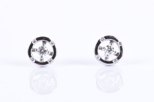 Lot 138 - A pair of 18ct white gold and diamond earrings...