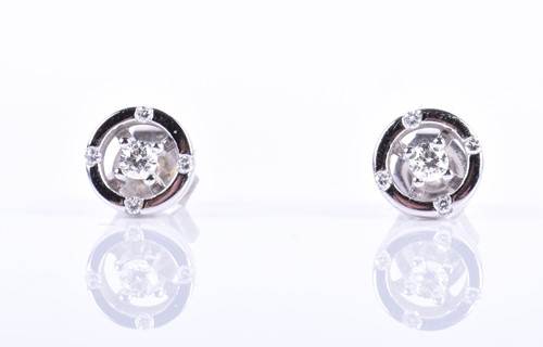 Lot 138 - A pair of 18ct white gold and diamond earrings...