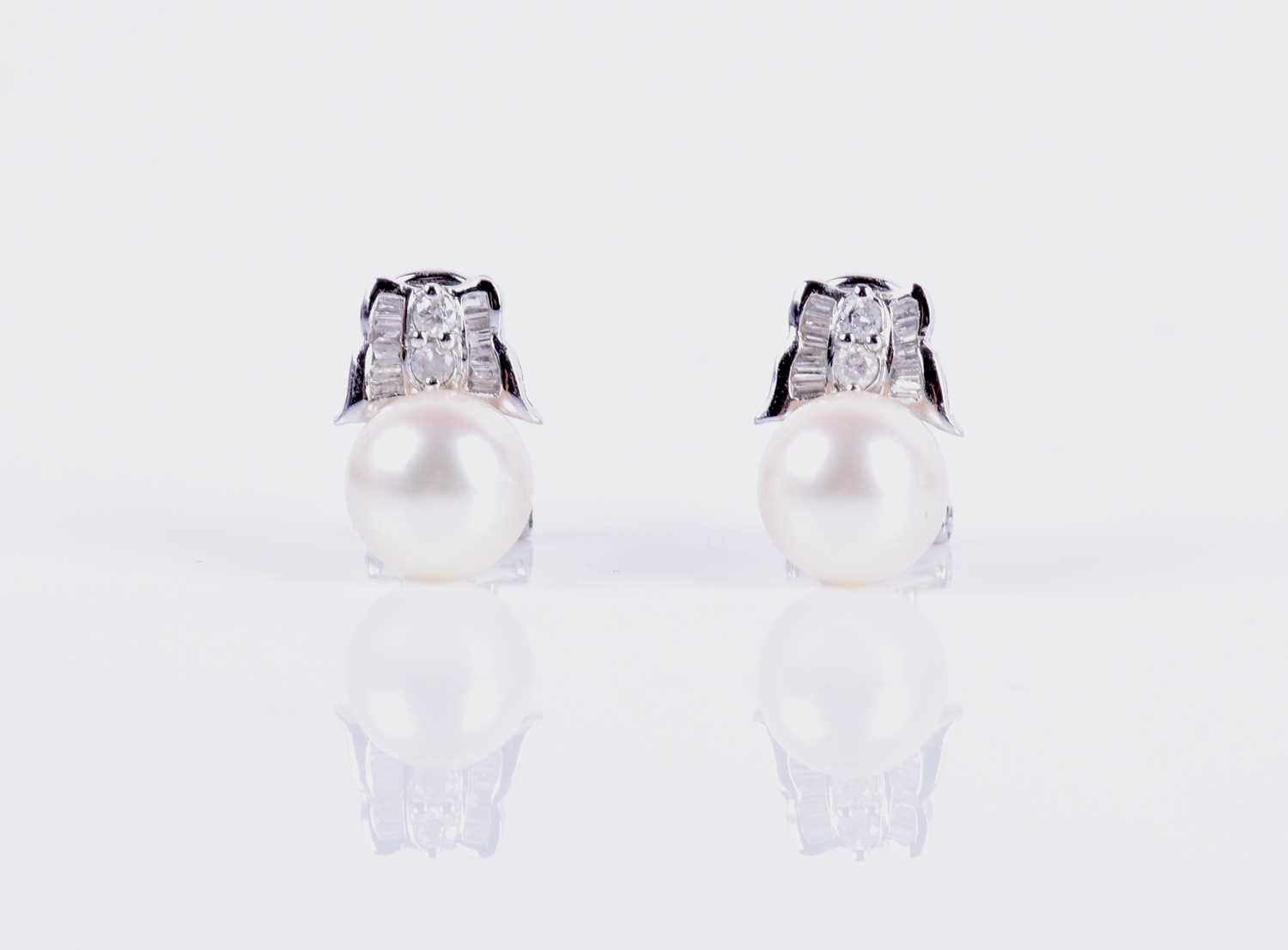 Lot 143 - A pair of 14ct white gold, diamond, and pearl...