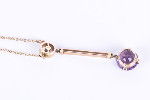 Lot 175 - An Edwardian 9ct yellow gold, amethyst, and...