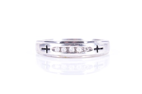 Lot 184 - A silver half eternity ring channel-set to...