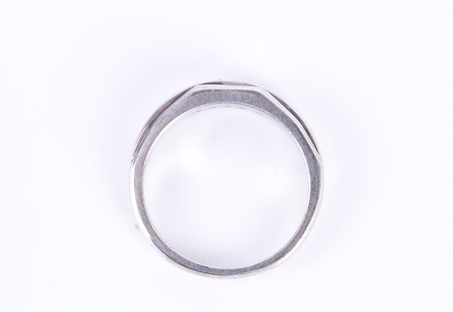 Lot 184 - A silver half eternity ring channel-set to...