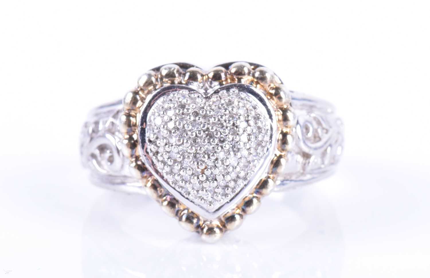 Lot 187 - An unusual silver and diamond ring the...