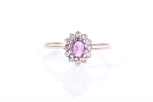 Lot 21 - A 9ct yellow gold, diamond and pink sapphire...