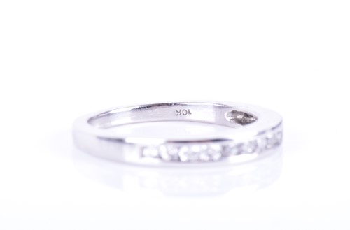 Lot 188 - A white gold and diamond half eternity ring...