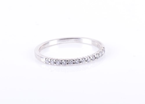 Lot 189 - A silver and diamond half eternity ring size N...