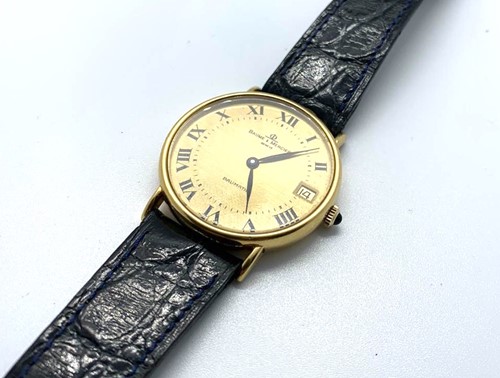 Lot 462 - An 18ct yellow gold Baume and Mercier wrist...