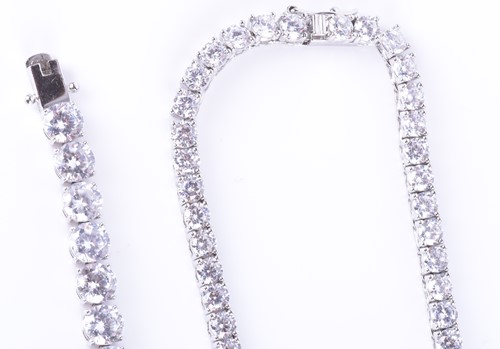 Lot 273 - A silver and cubic zirconia line necklace set...