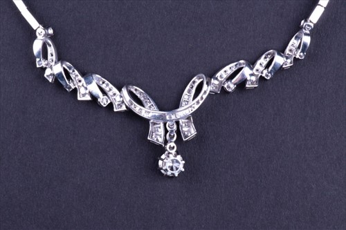 Lot 411 - An 18ct white gold and diamond necklace...