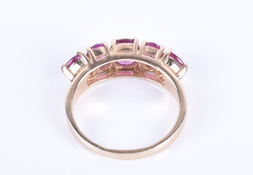 Lot 284 - A 14ct yellow gold and pink sapphire ring set...