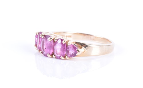 Lot 284 - A 14ct yellow gold and pink sapphire ring set...