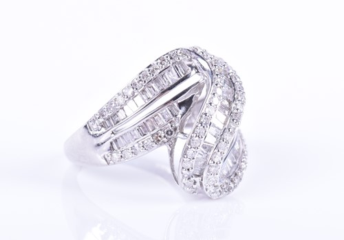 Lot 289 - A white gold and diamond swirled crossover...