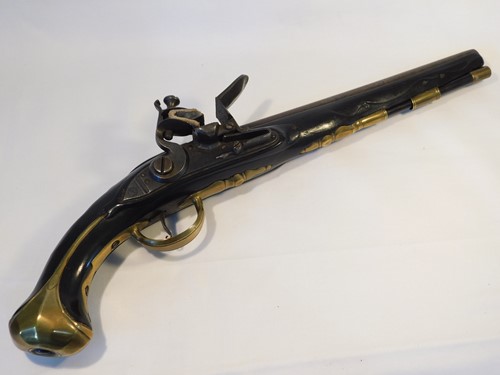Lot 567 - An 18th century flintlock pistol, the carved...