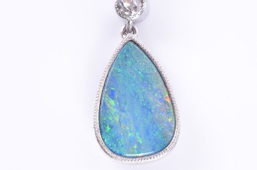 Lot 322 - An 18ct white gold, diamond, and opal pendant...