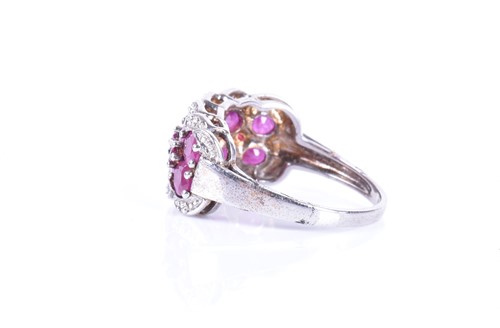 Lot 330 - A 9ct white gold, diamond, and ruby ring set...