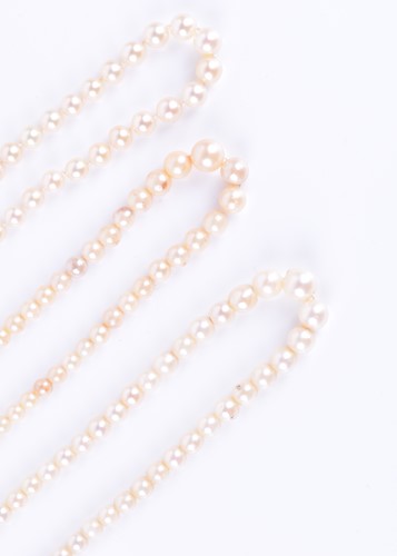 Lot 341 - Three pearl necklaces of cultured pearls, one...
