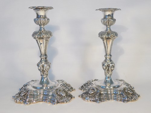 Lot 454 - A pair of Irish cast silver candlesticks,...