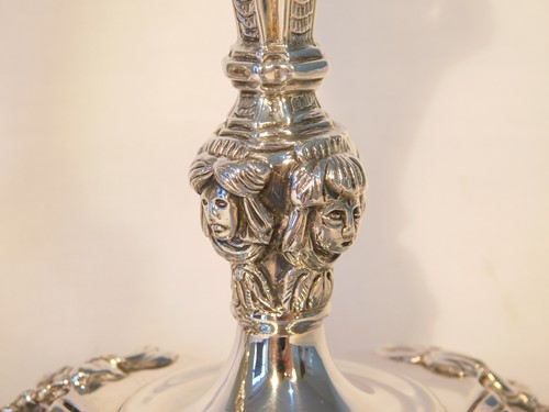 Lot 454 - A pair of Irish cast silver candlesticks,...