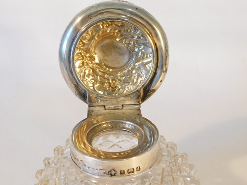 Lot 446 - An Edwardian cut glass and silver mounted...