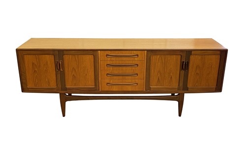 Lot 513 - A G-Plan dining suite comprising table, four...