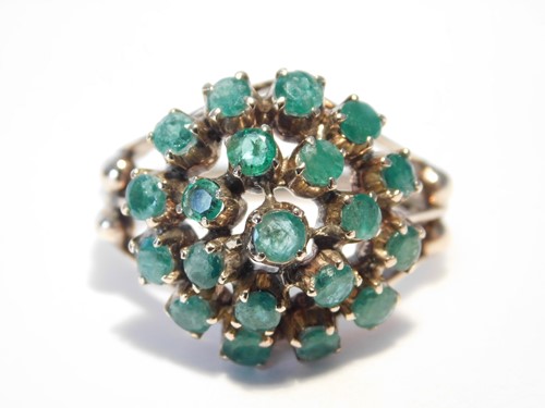 Lot 355 - An 18ct rose gold emerald cluster ring, the...