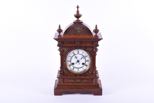 Lot 470 - A late 19th century oak mantel clock, the...