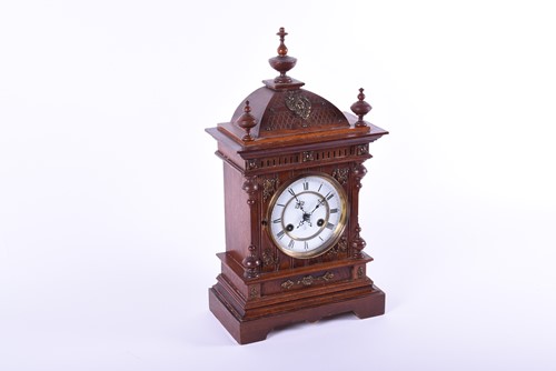 Lot 470 - A late 19th century oak mantel clock, the...