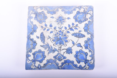 Lot 187 - A Persian pottery blue and white tile,...