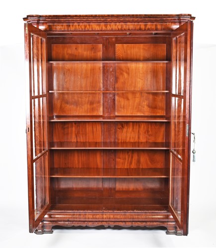 Lot 131 - A large 19th century flame mahogany bookcase,...