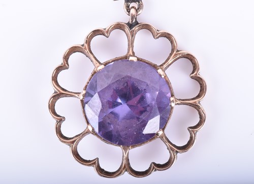 Lot 181 - A yellow metal and synthetic corundum pendant,...
