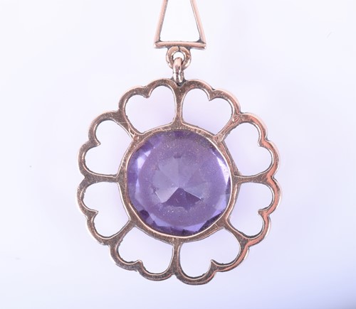 Lot 181 - A yellow metal and synthetic corundum pendant,...