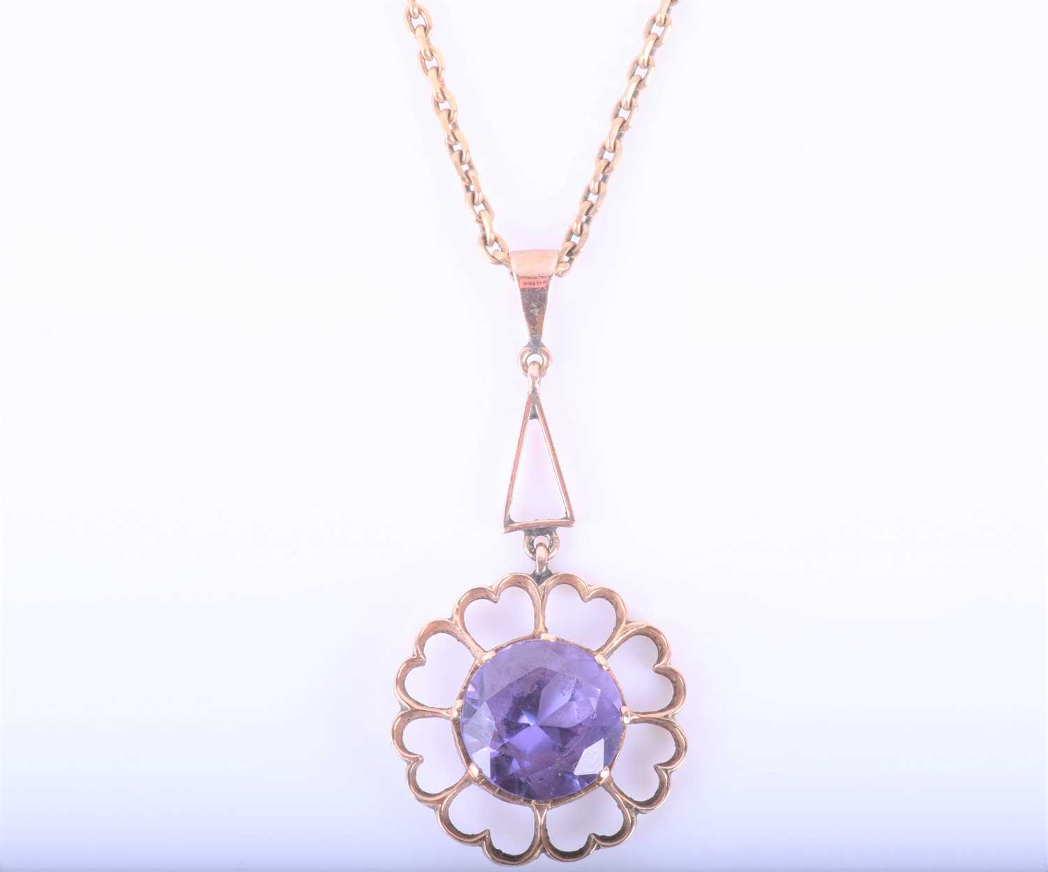 Lot 181 - A yellow metal and synthetic corundum pendant,...