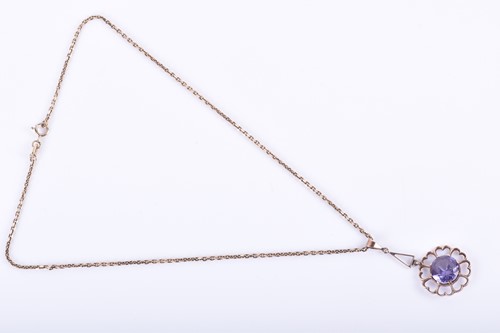 Lot 181 - A yellow metal and synthetic corundum pendant,...