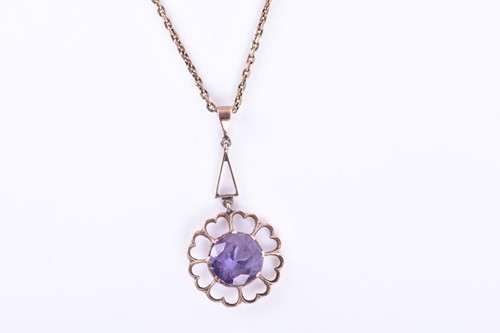 Lot 181 - A yellow metal and synthetic corundum pendant,...