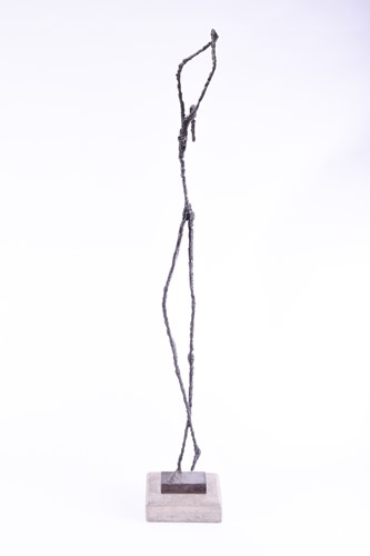Lot 73 - A Giacometti style metal figure, 20th century,...
