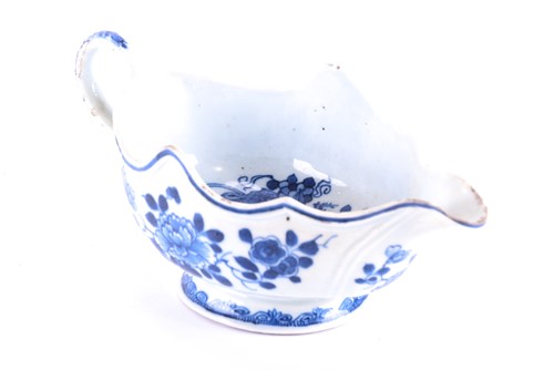 Lot 214 - An 18th century Chinese blue and white gravy...