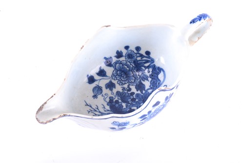 Lot 214 - An 18th century Chinese blue and white gravy...