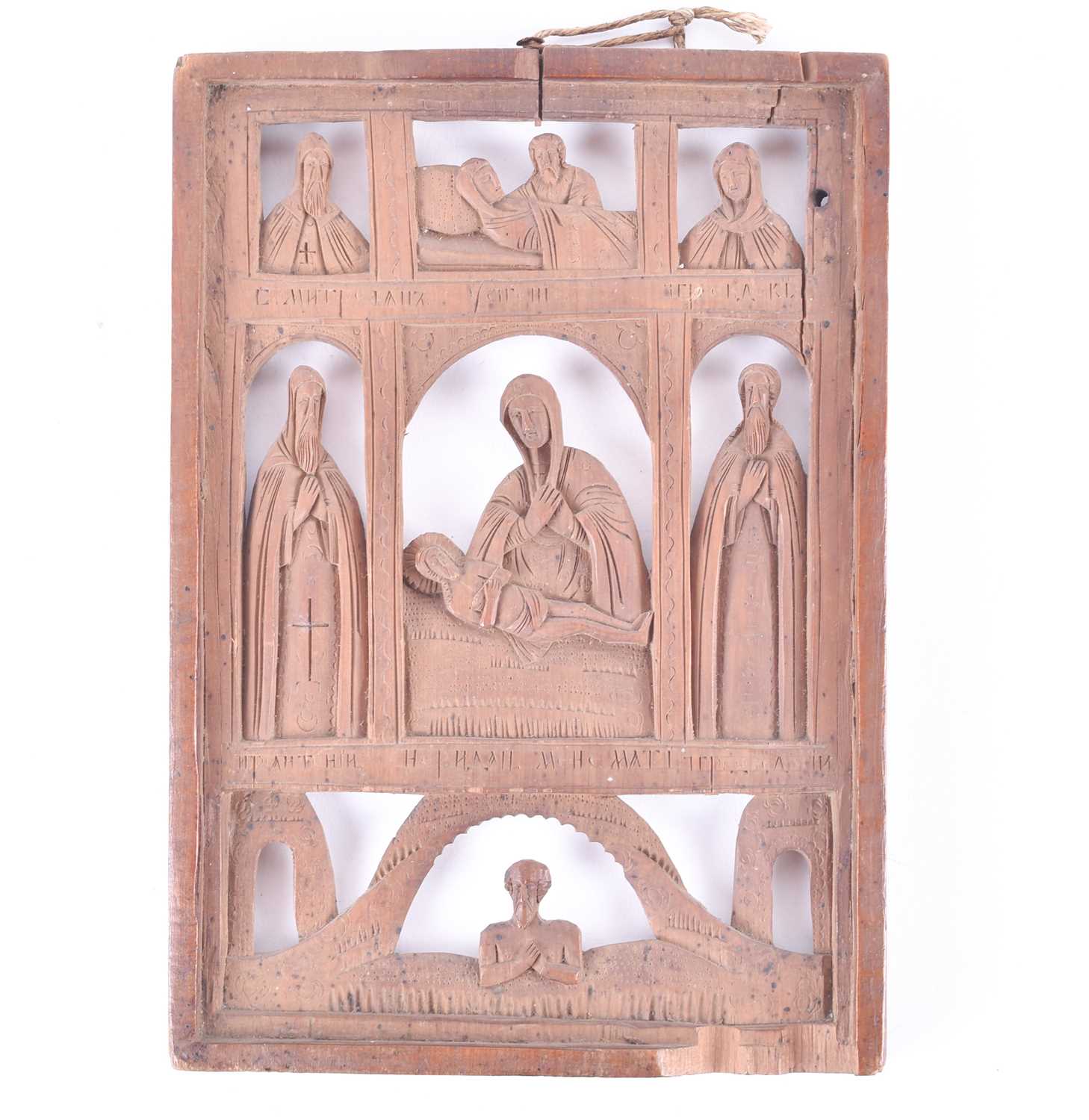 Lot 469 - A 19th century Russian carved wood icon with...