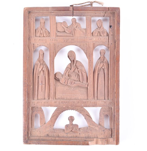 Lot 469 - A 19th century Russian carved wood icon with...