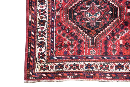 Lot 198 - An Afghan rug, 20th century, with two hooked...