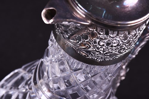 Lot 628 - An art nouveau style silver mounted wine ewer,...