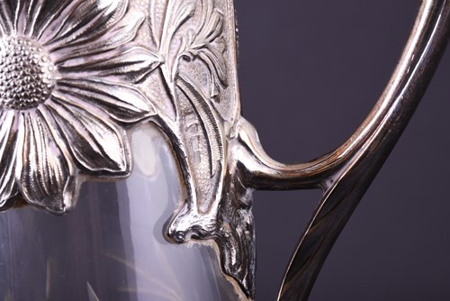 Lot 628 - An art nouveau style silver mounted wine ewer,...