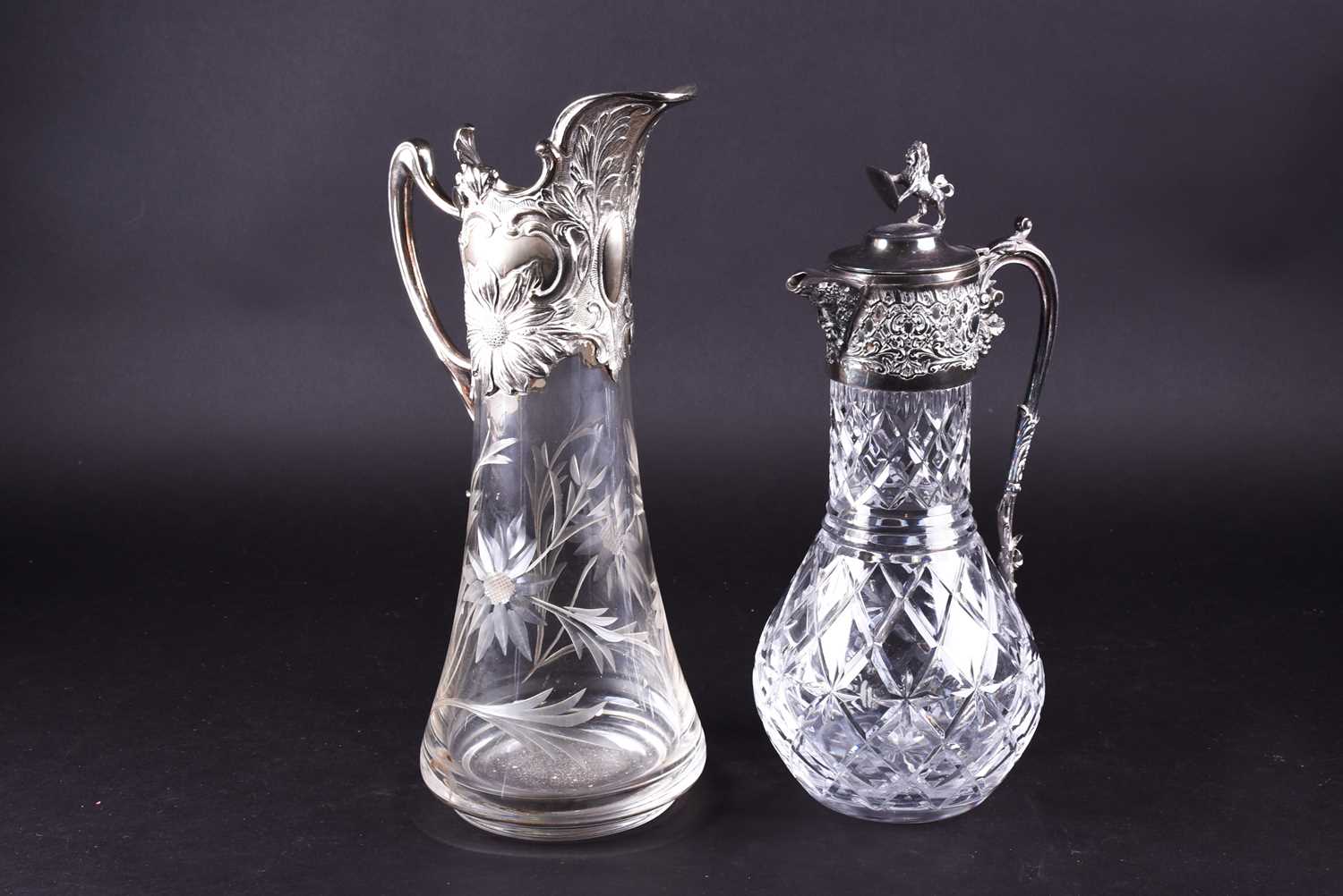 Lot 628 - An art nouveau style silver mounted wine ewer,...