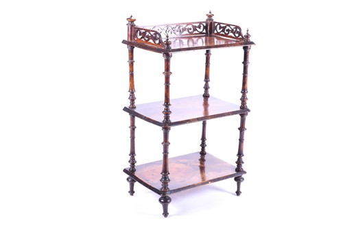 Lot 168 - A Victorian walnut three tier whatnot, with...