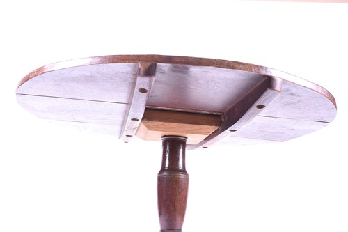 Lot 152 - A Geo III oak tilt top tripod table, with...
