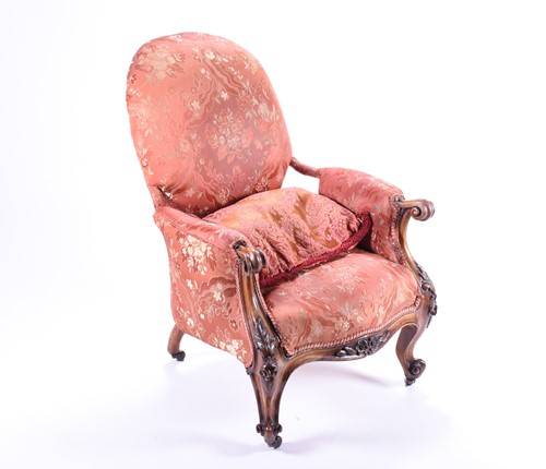 Lot 100 - A Victorian upholstered armchair with carved...