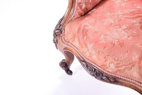 Lot 100 - A Victorian upholstered armchair with carved...