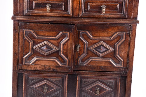 Lot 147 - An oak cupboard with blind gallery back, 17th...