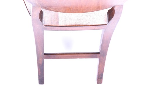 Lot 109 - A 19th century mahogany hall chair, the shield...
